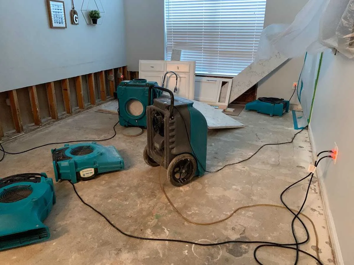 Dehumidifier in flood-cut room for Water Damage Restoration in Watertown